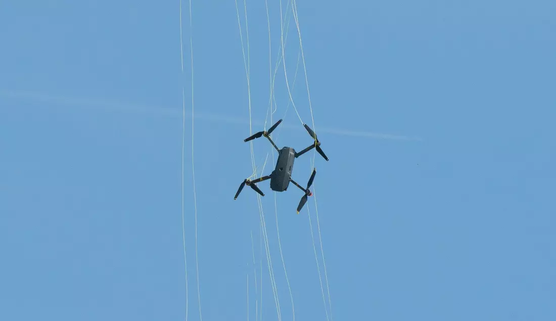 Drone hunter catching rogue drone into a net